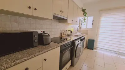 a kitchen with a sink and a stove at STAY Naturaleza Penthouse in Limassol