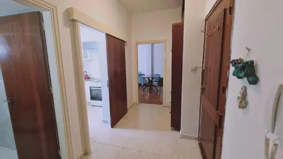 a hallway with two doors leading to a room at STAY Antique Apartment in Larnaka