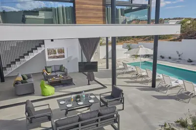 a living room with a pool and a house at Protaras Elite Pearl Ville Ep3c in Protaras