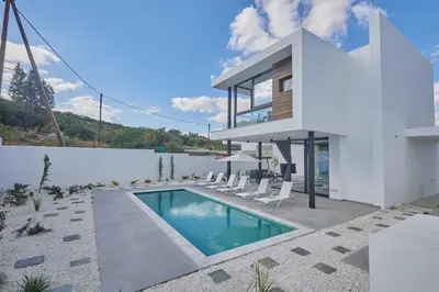 a villa with a swimming pool and a house at Protaras Elite Pearl Ville Ep3c in Protaras