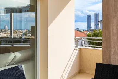 a balcony with a view of a city at Central Bliss / your perfect home away from home in Limassol