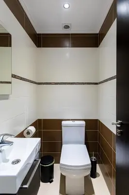 a bathroom with a toilet and a sink at Central Bliss / your perfect home away from home in Limassol