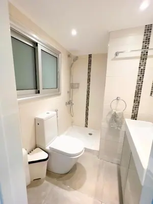 a bathroom with a toilet and a sink at Panoramic Sea View Apt - 2bed in Limassol