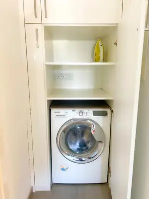 a washer and dryer in a white closet at Panoramic Sea View Apt - 2bed in Limassol