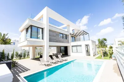 a villa with a swimming pool and a house at Luxury Panorama Villa Protaras in Protaras