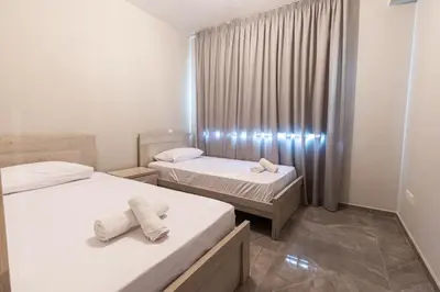 a room with two beds with towels on them at Luxury Panorama Villa Protaras in Protaras