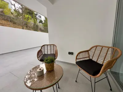 two chairs and a table in a room at Panorama Residence in Nicosia
