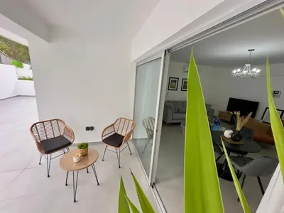 a living room with chairs and a table at Panorama Residence in Nicosia
