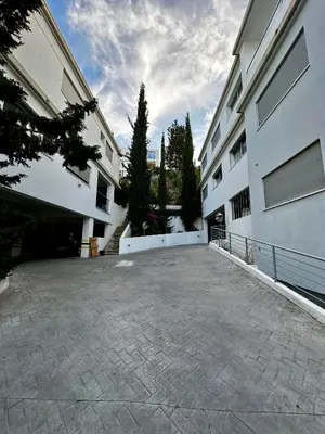 an empty parking lot in front of a building at Panorama Residence in Nicosia