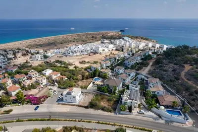 an aerial view of a residential neighborhood with the ocean at Villa Sea Horizon in Protaras