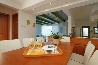 a dining room with a table with glasses of wine at Villa Sea Horizon in Protaras