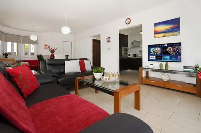 a living room with a couch and a table at Villa Crystalia - 350m from Kalamies Beach in Protaras