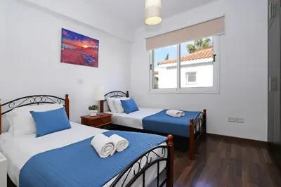 a bedroom with two beds and a window at Villa Crystalia - 350m from Kalamies Beach in Protaras