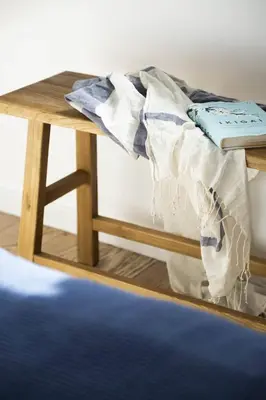 a wooden table with a blanket on top of a bed at Villa Orchard by Tangerine in Protaras