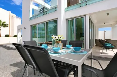 a dining room with a table and chairs at Villa Indigo in Protaras