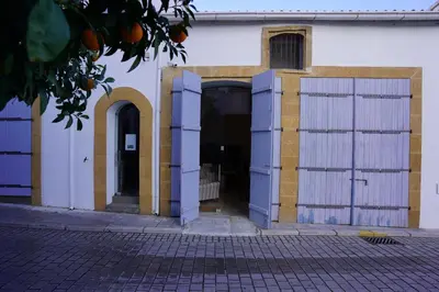 an entrance to a building with white and yellow doors at Large Kamara Studio in Nicosia