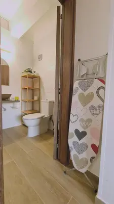 a bathroom with a toilet and a toilet seat at STAY Sunlit Apartment in Limassol