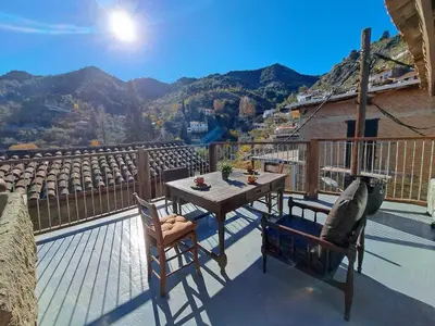 a table and chairs on a balcony with a view at PITHARIA in Askas