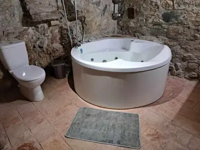 a bathroom with a bath tub and a toilet at PITHARIA in Askas