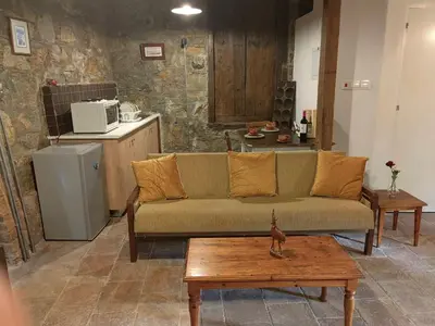 a living room with a couch and a coffee table at PITHARIA in Askas
