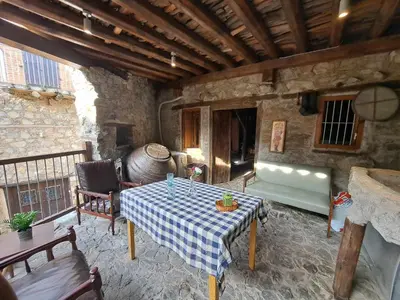 a living room with a table and a couch at PITHARIA in Askas