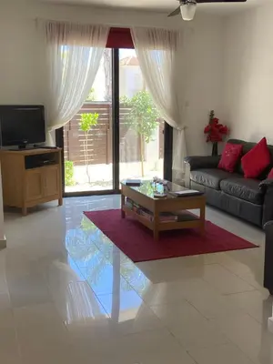 a living room with a couch and a coffee table at Villa Ocean Breeze in Paralimni