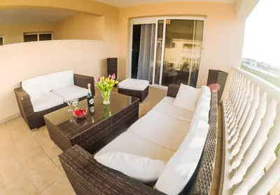 a balcony with white couches and a table at 3 bed, Kapparis, Thea - 3A in Paralimni