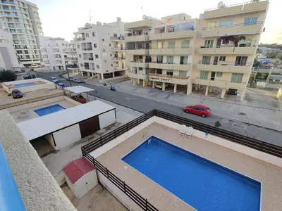 an overhead view of a building with a swimming pool at Maestro II Apartment in Larnaka