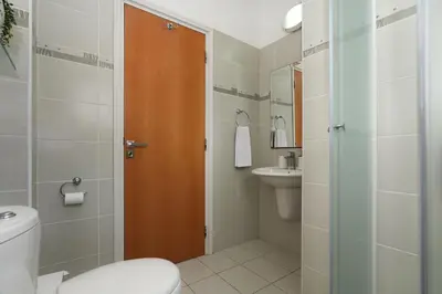 a bathroom with a toilet and a sink at Villa Maya - 4bed with Private Heated Pool in Paralimni