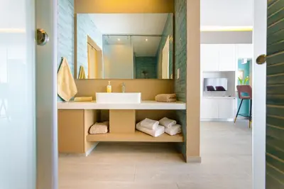 a bathroom with a sink and a mirror at Apartament De Lux MS 1 - C in Paralimni