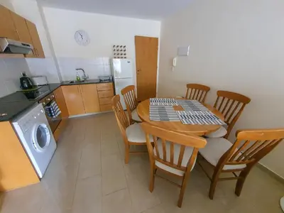 a kitchen with a table and chairs in a kitchen at 3 bed, Kapparis, Thea - 3C in Paralimni