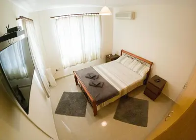a small bedroom with a bed and a window at 3 bed, Kapparis, Thea - 3C in Paralimni