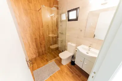 a bathroom with a toilet and a shower and a sink at 2 bed, Kapparis, Trinidad - 2A in Paralimni