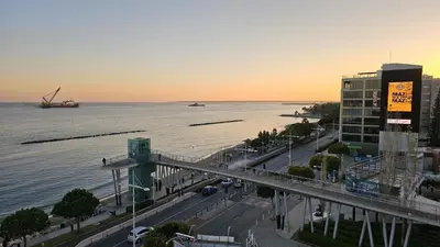 a view of a city with a bridge over the water at STAY Sky Apartment in Limassol