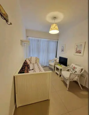 a living room with a table and chairs in it at Butterfly Home in Platres