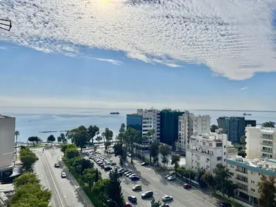 a view of a city with cars parked on a street at Enaerios SeaView Studio in Limassol