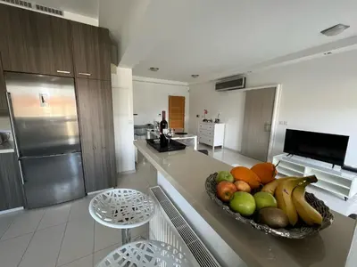 a kitchen with a bowl of fruit on a counter at Majestic Boutique Apartment/2BR in Nicosia