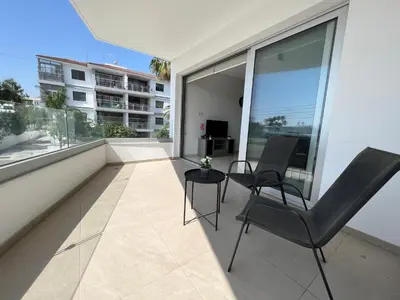 a balcony with two chairs and a table at Kings Boutique Apartment/2BR in Strovolos