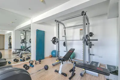 a room with a gym with several machines at Eden Dream Apartments in Limassol