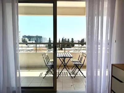 a view of a balcony with a table and chairs at Eden Dream Apartments in Limassol