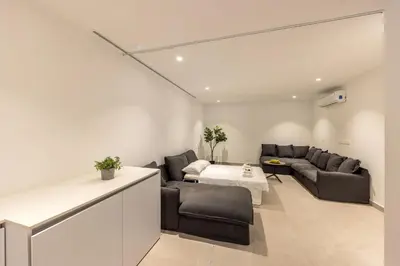 a living room with couches and a table at Protaras Periyiali Seaside Villa 33 in Protaras