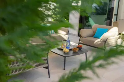 a living room with a couch and a coffee table at Protaras Periyiali Seaside Villa 33 in Protaras