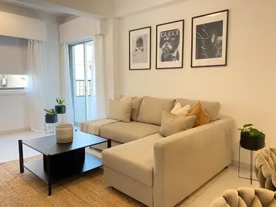a living room with a couch and a table at Central Boutique Twenty One in Nicosia