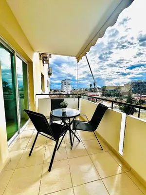 a balcony with a table and chairs on a balcony at Mackenzie 11 in Larnaka