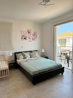 a bedroom with a bed and a balcony at Villa TaMalDi side sea view - new renovated! in Paralimni