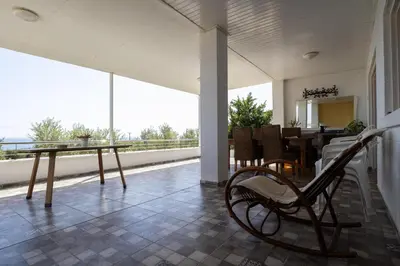 a room with a table and a bench in a room at Captivating 2-Bed House in Alaminos
