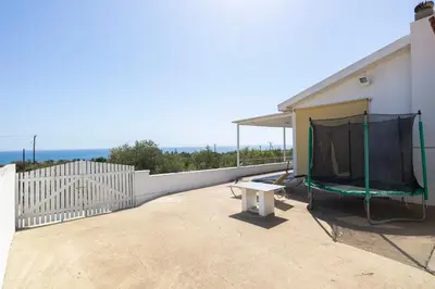 a patio with a canopy on a house at Captivating 2-Bed House in Alaminos