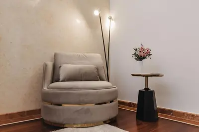 a reclining chair in a room with a table at 16 EXECUTIVE SUITES in Nicosia
