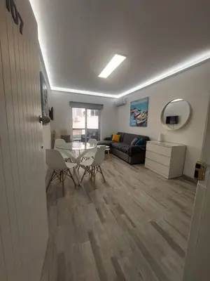 a living room with a table and a couch at AMAZING TWO BEDROOM APARTMENT in Ayia Napa
