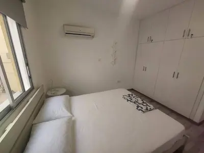 a white room with a bed and a window at AMAZING TWO BEDROOM APARTMENT in Ayia Napa